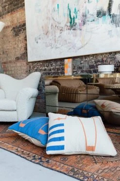 K-apostrophe Serpents + Ladders Blanco Wool Floor Pillow Home Goods